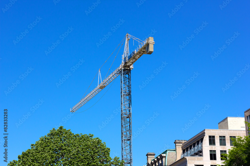 Obraz premium Construction crane in the city.