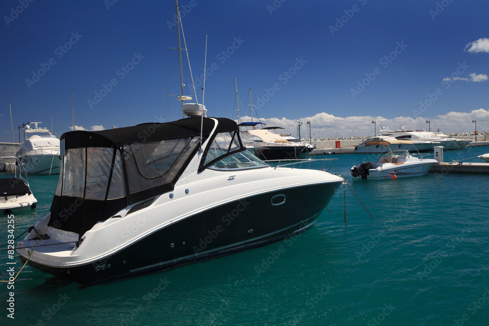 Fototapeta premium Small pleasure yacht in the harbor close-up 