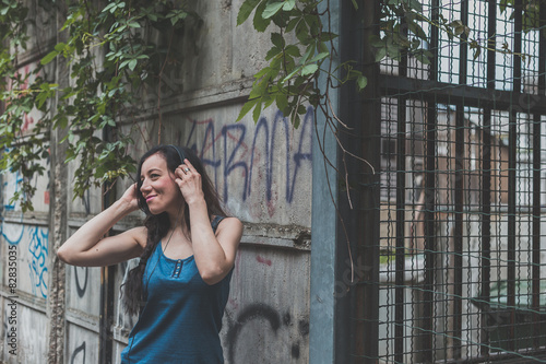 Beautiful girl posing in the city streets © tinx