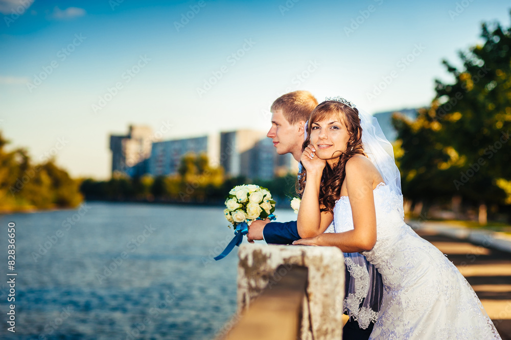 Bride and Groom at wedding Day walking Outdoors on spring nature Bride and Groom at wedding Day walking Outdoors on spring nature