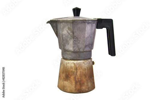 Old, used and rusty italian coffee maker isolated on a white