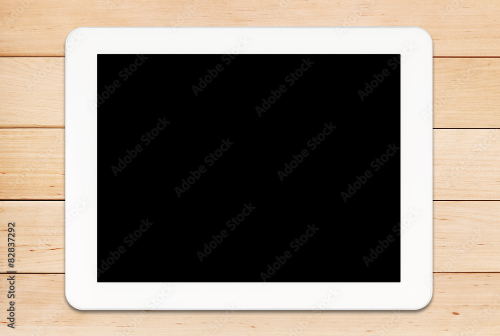 Tablet PC on a wooden table Tablet PC on a wooden table