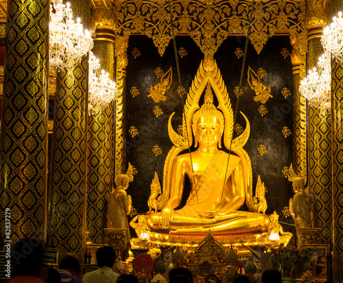 Thai art, golden buddha statuein Phitsanulok, Thailand photo