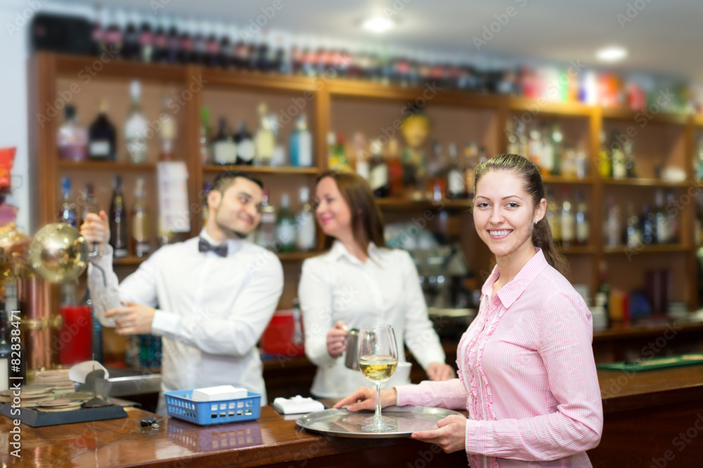 Waitress holding tray with glasses