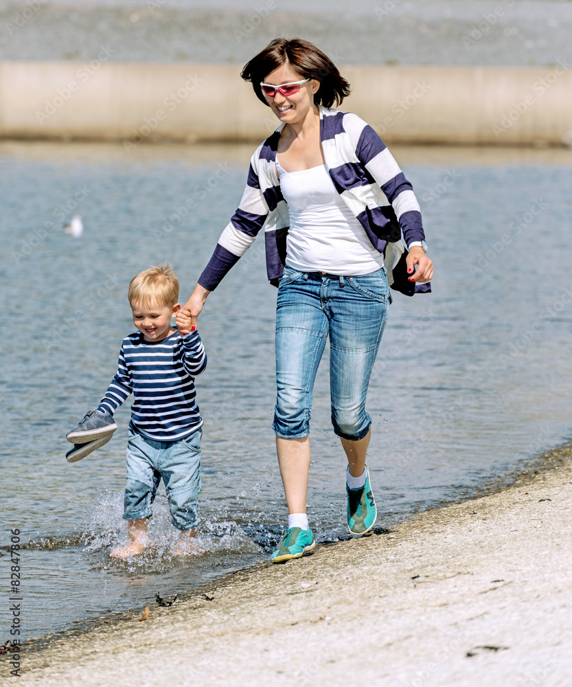 Lovely portrait of a mother and son outdoor at shore Lovely portrait of a mother and son outdoor at shore