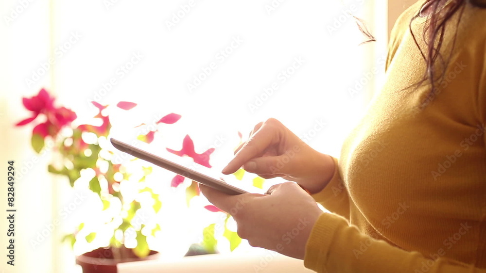 Woman uses digital tablet Woman uses digital tablet