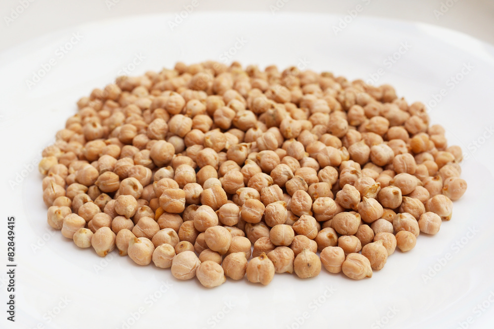 Plate with raw chickpeas Plate with raw chickpeas