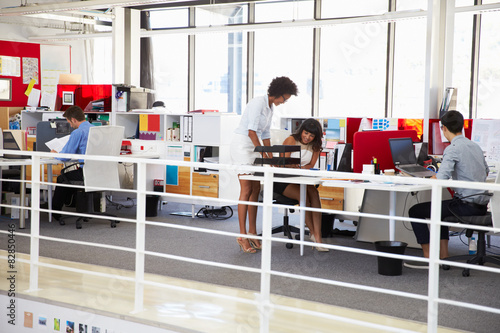 Fotografie Staff working in a busy office mezzanine
