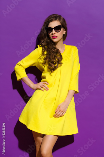 Girl in Sunny Dress on a Violet Background