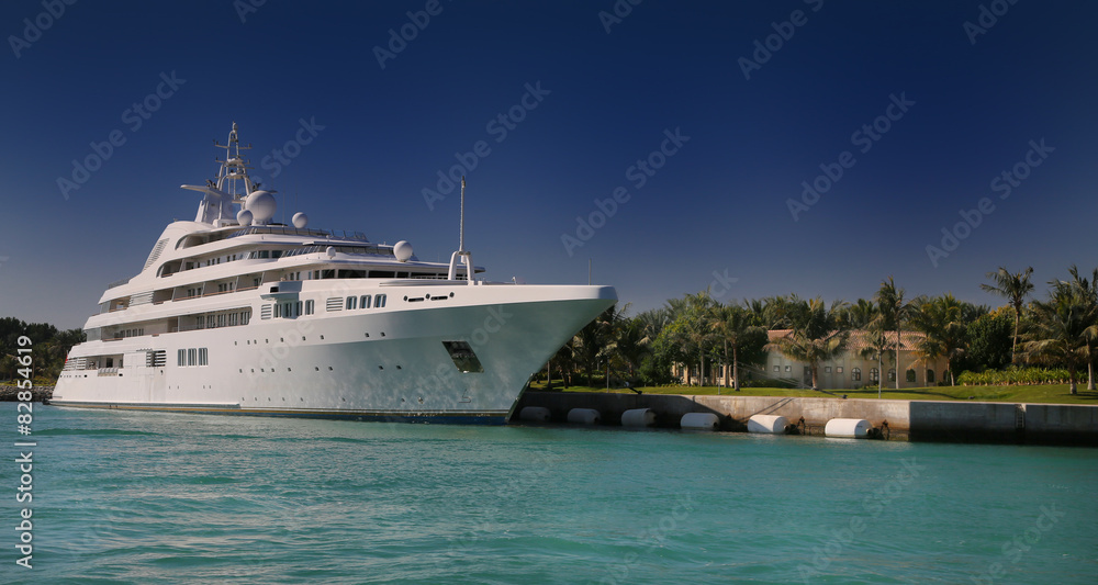 Luxury Yacht in front of tropical island