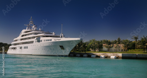 Luxury Yacht in front of tropical island