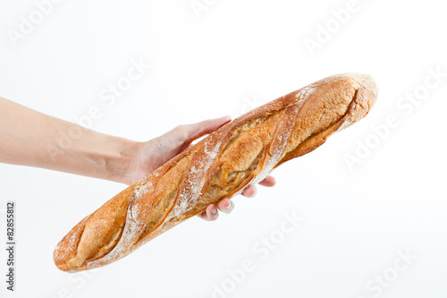 Quadro su tela Hand holding a French baquette