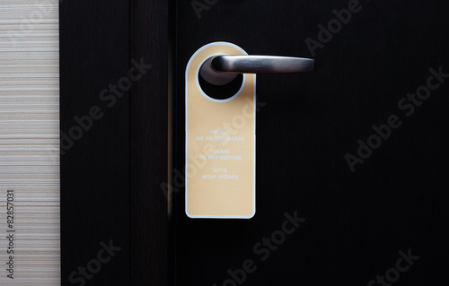Do not disturb sign handle on a hotel door, close up