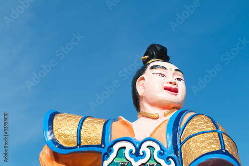 Ornate Chinese Temple detail in the sky. photo