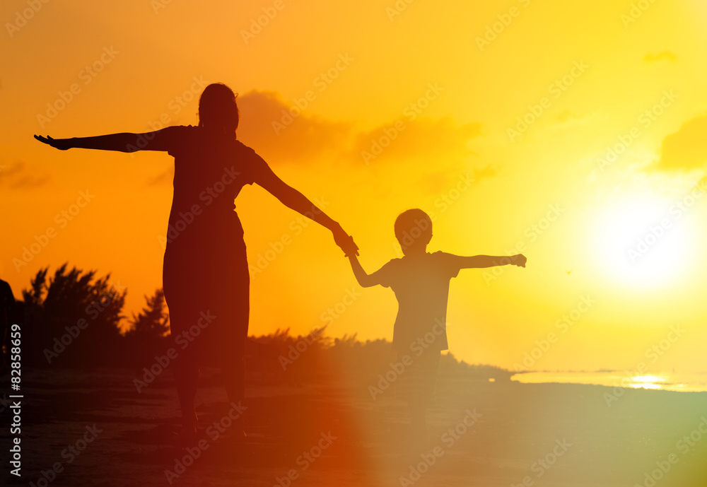 mother and son having fun on sunset