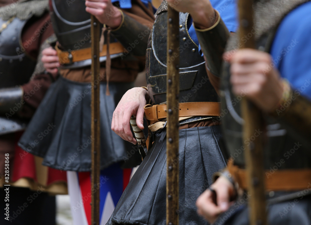 soldiers with medieval uniforms with the old weapons in hand