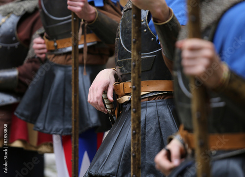 soldiers with medieval uniforms with the old weapons in hand