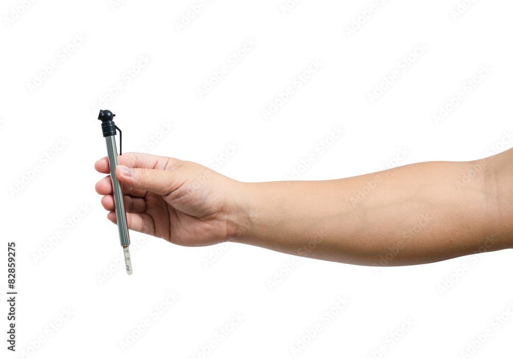 Isolated hand holding a tire pressure gauge Isolated hand holding a tire pressure gauge