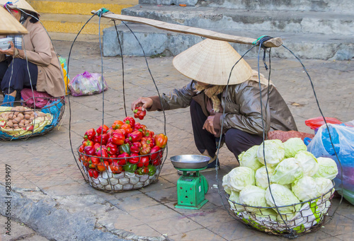 Vietnamese vendors selling fruit and vegetables at Dalat market