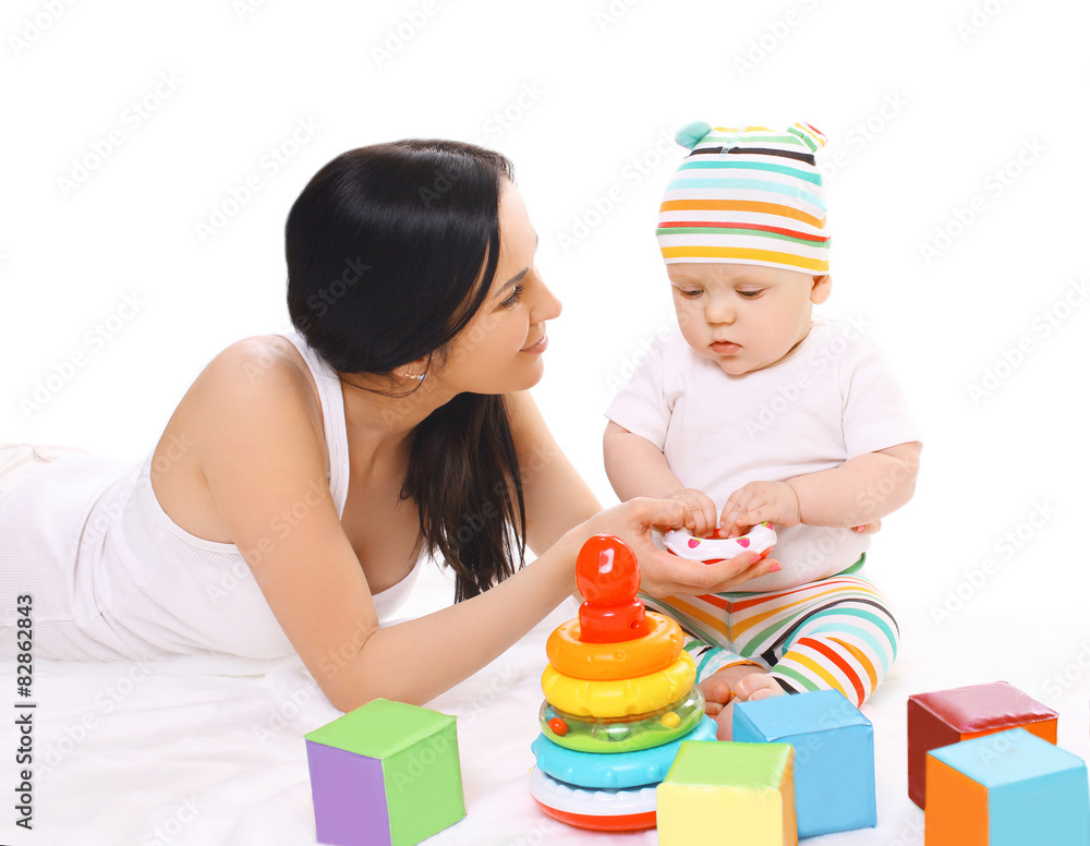 Young mother and baby playing with toys together Young mother and baby playing with toys together