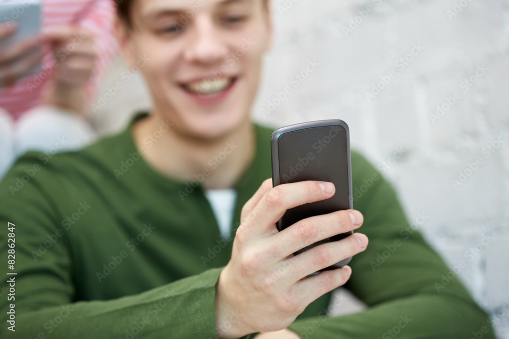 close up of young man with smartphone close up of young man with smartphone