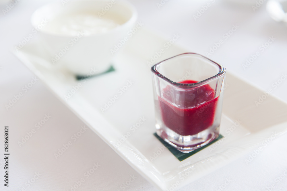 close up of yogurt and jam at restaurant close up of yogurt and jam at restaurant