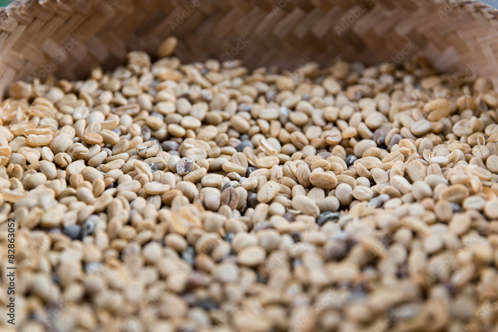 close up of unroasted coffee beans in basket close up of unroasted coffee beans in basket