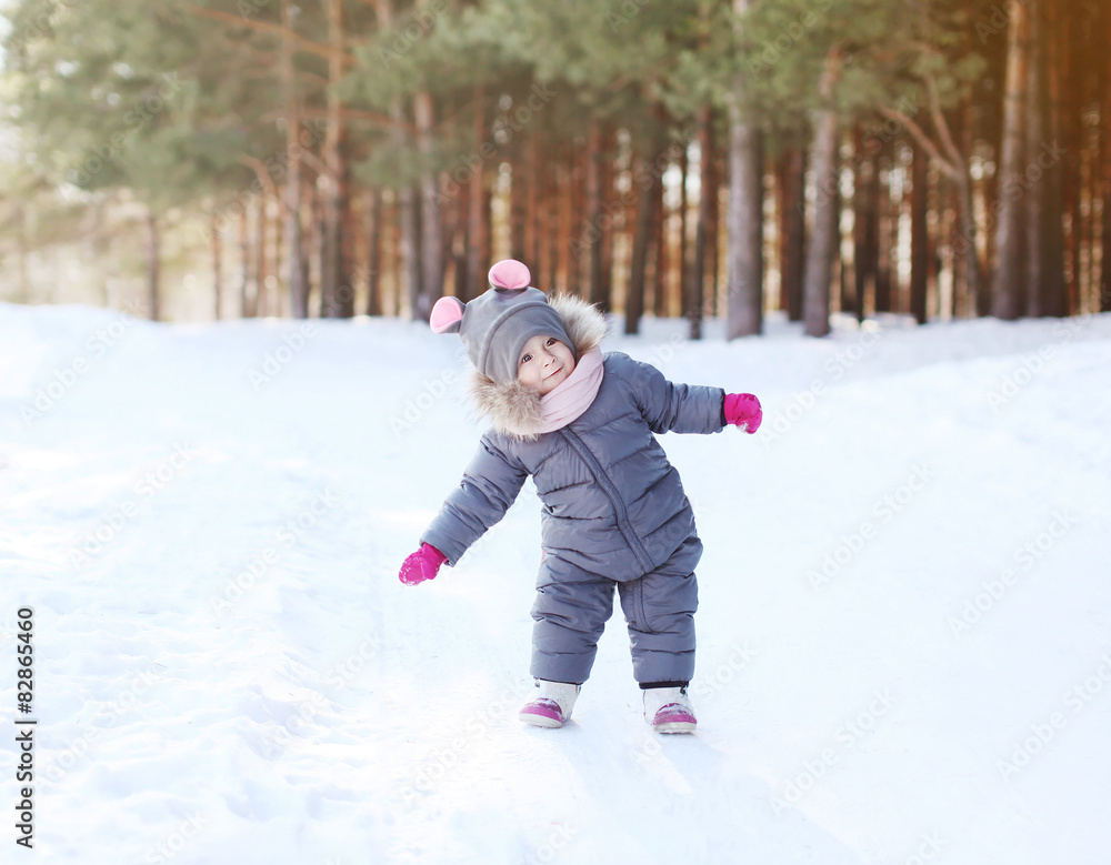 Positive child having fun in winter day