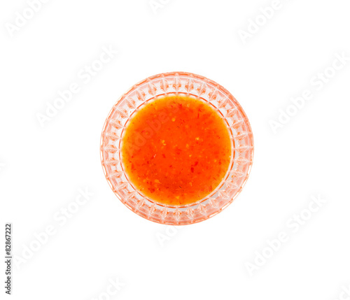 Homemade chili sauce in a bowl over white background