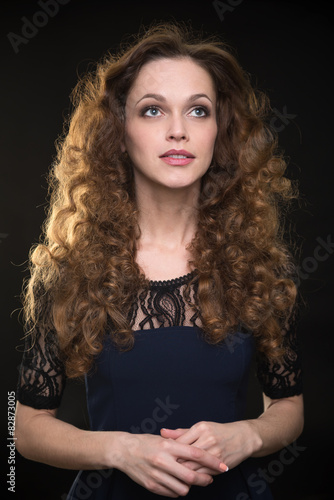 Beautiful woman with long brown curly hair