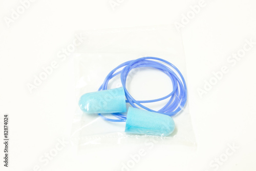 blue ear plugs in package on white background