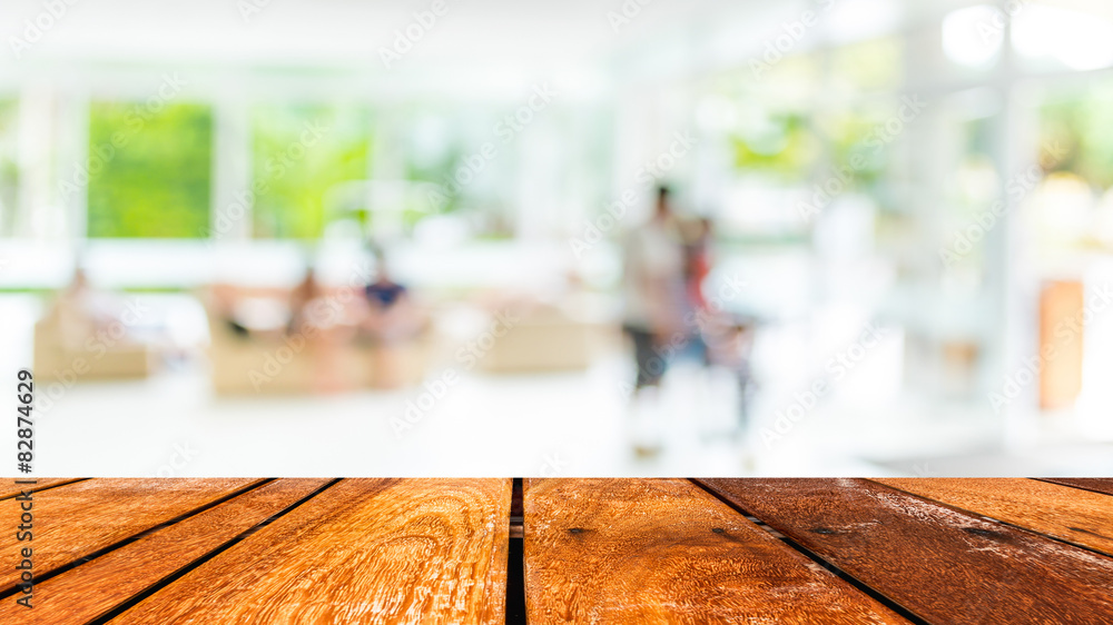 Empty wood table and Coffee shop blur background with bokeh imag