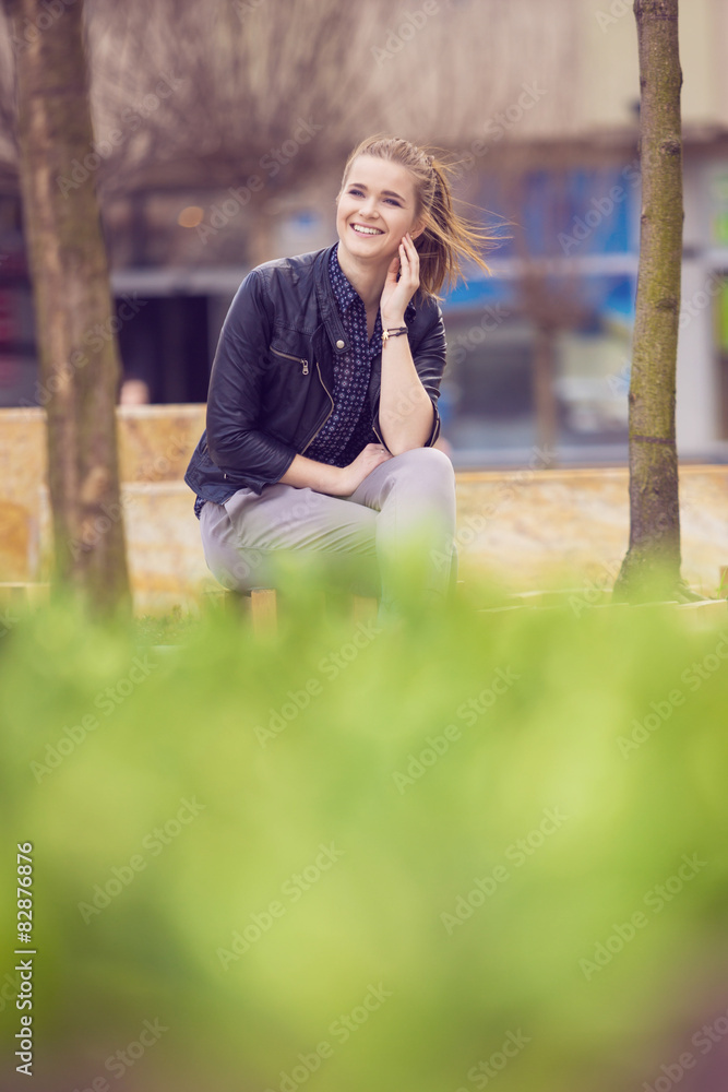 Smiling cheerful woman relaxing on fresh air Smiling cheerful woman relaxing on fresh air