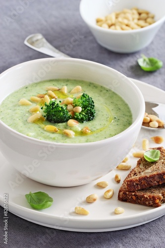 Broccoli-potato  soup with pine nuts and broccoli topping