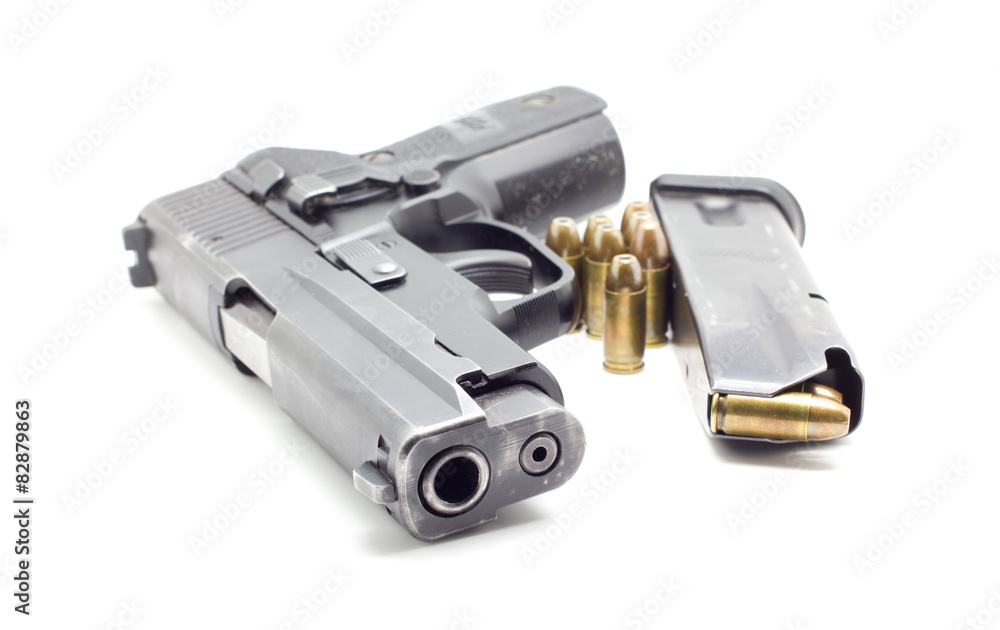 pistol with ammo on white background