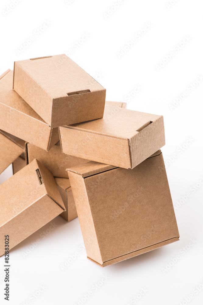 Fototapeta premium Brown cardboard boxes on a white background