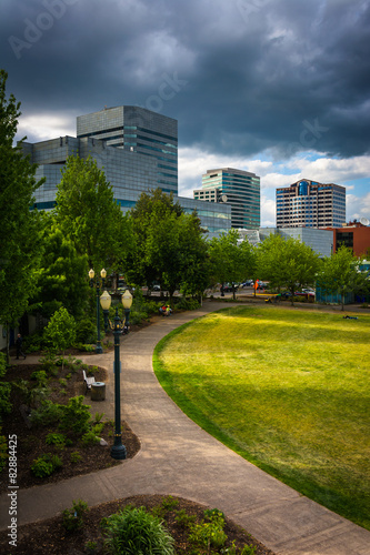 Walkway at Tom McCall Waterfront Park and buildings in Portland,