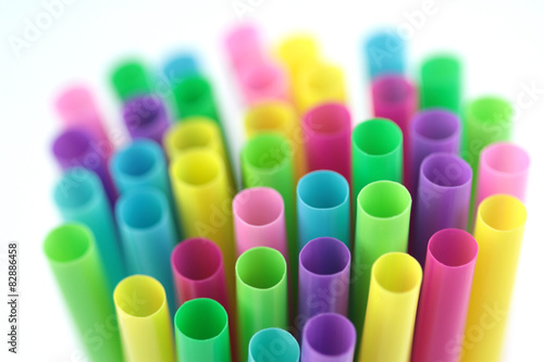 Colorful cocktail straws on white background 