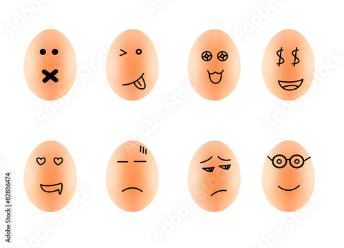 Funny Drawing Faces on Eggs in carton isolate on white with clip