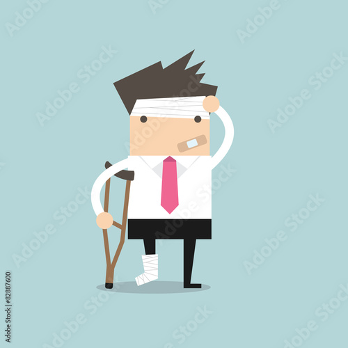 Businessman injured standing with crutches