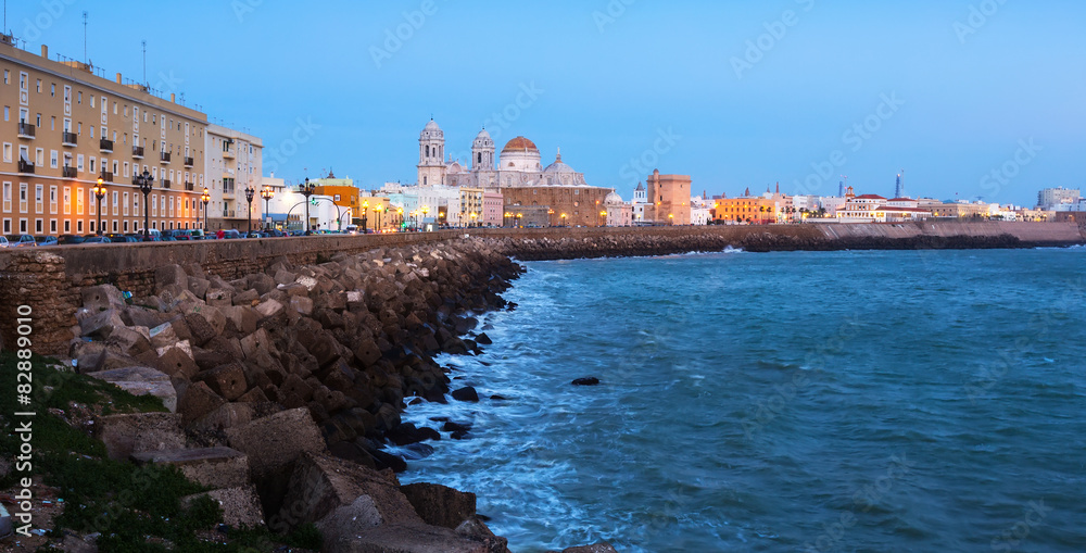 Ocean   embankment and Cathedral in twilight. Cadiz
