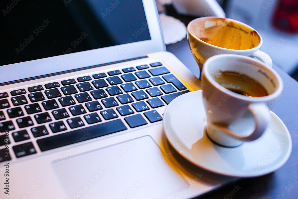 Laptop and cup of coffe Laptop and cup of coffe