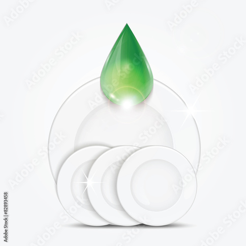 Set of clean dishes and green drop