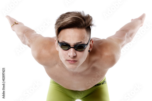 Profile of young , caucasian athlete swimmer with goggles in sta