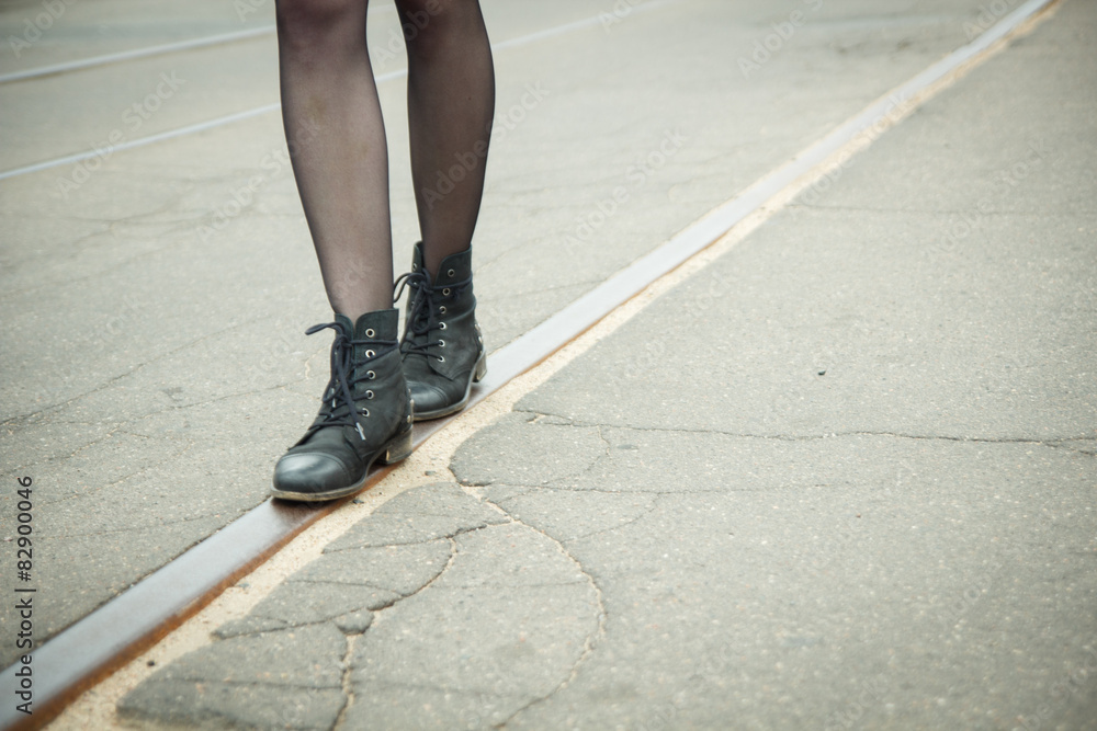 Girl walking on the tracks of the tram
Girl walking on the tracks of the tram