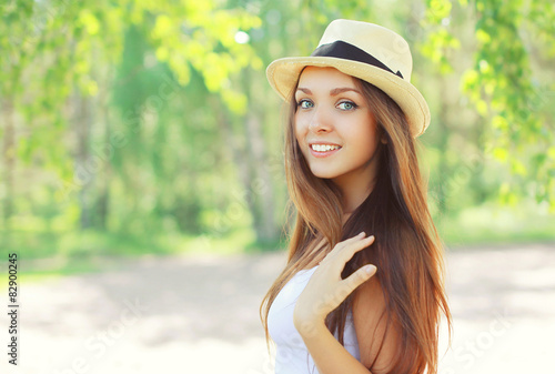 Summer portrait of beautiful young girl in hat on nature © rohappy