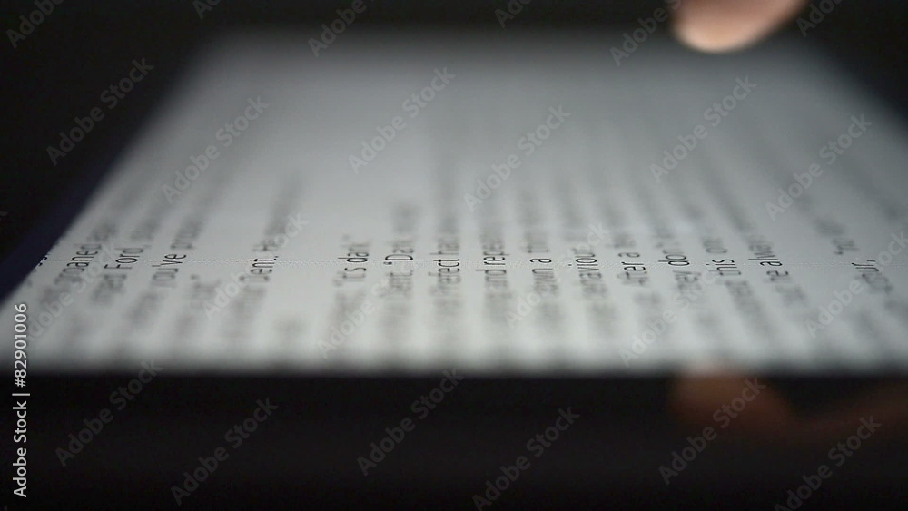 closeup finger touching tablet computer touchscreen closeup finger touching tablet computer touchscreen