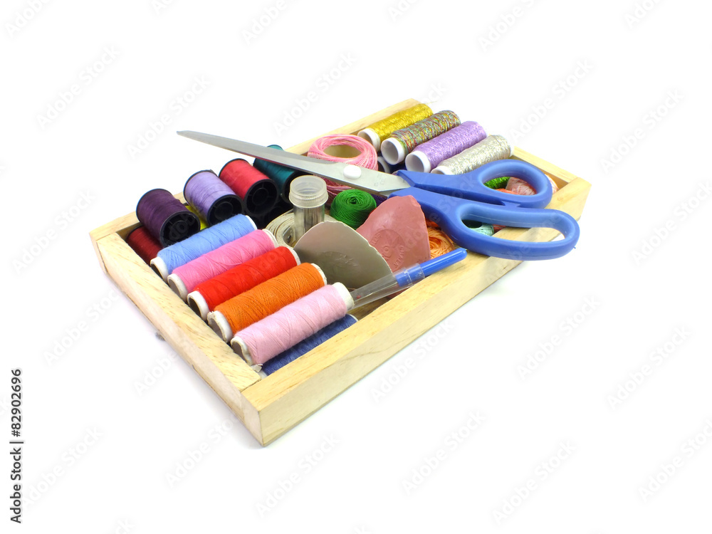 Fototapeta premium multicolor sewing threads on white background
