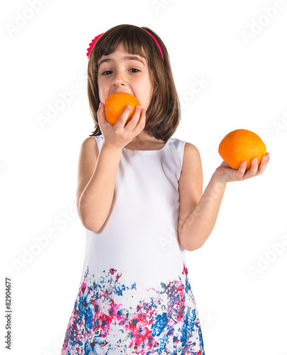 Girl eating oranges