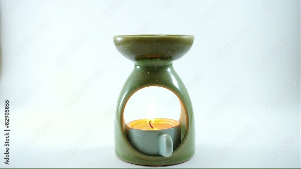 candle burnning inside ceramic aroma burner candle burnning inside ceramic aroma burner